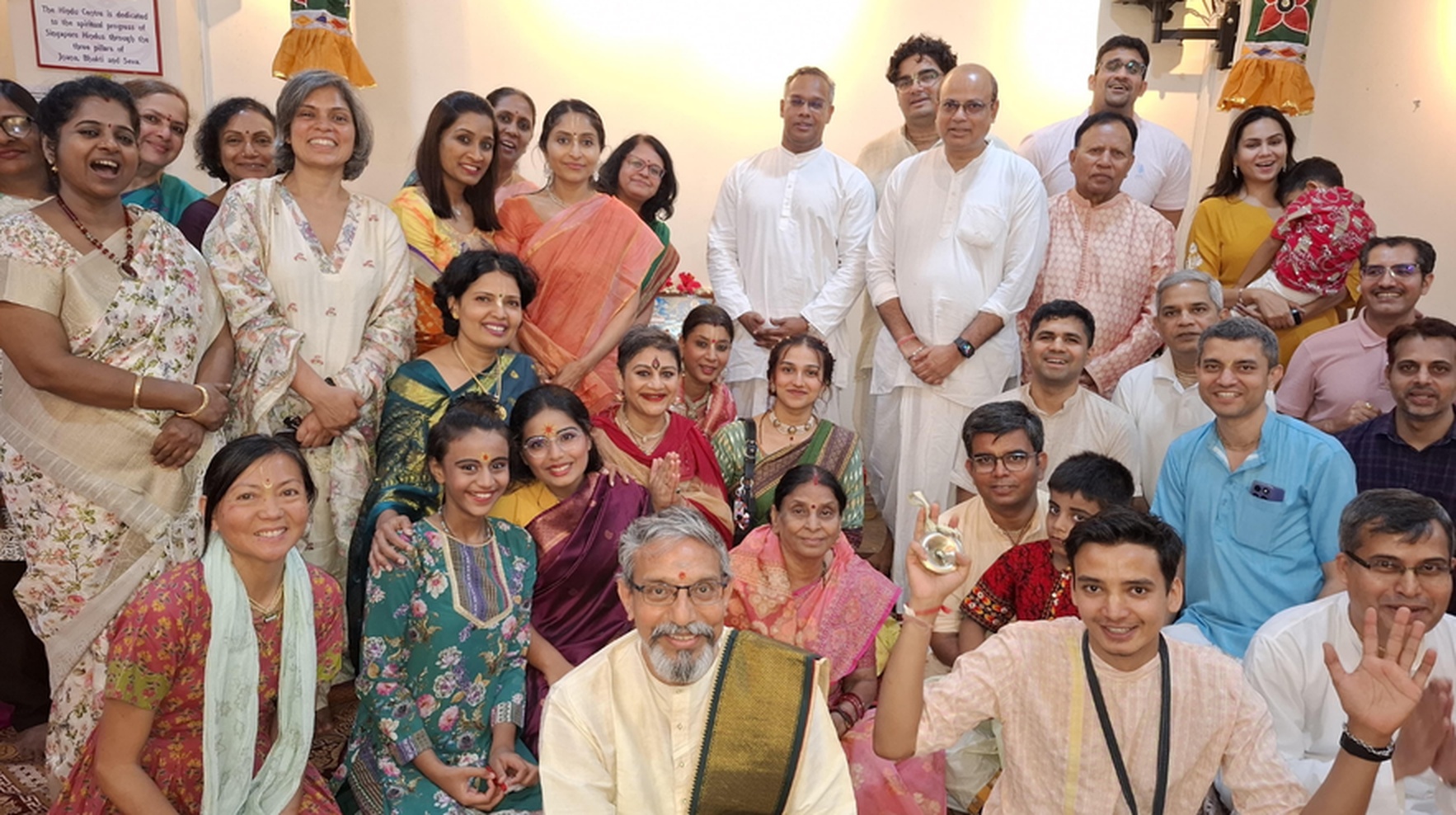 Hindu Centre community gathered in traditional dress for a festive celebration